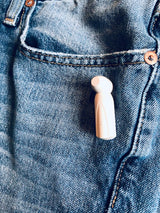 Stylus Tag Gray - Sensormatic Compatible 58KHz, close up attached below a jeans pocket