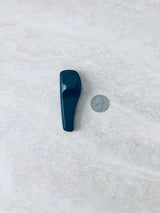 Sensormatic SuperTag II Black - 58KHz, shown next to a quarter for scale