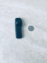 Sensormatic SuperTag I Black - 58KHz, shown next to a quarter for scale