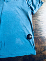 Clam Tag Black (New) - Sensormatic Compatible 58KHz, attached to the hem of a shirt