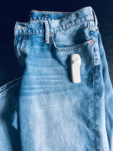 Sensormatic SuperTag I Gray - 58KHz, attached to a jeans pocket