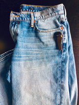 Sensormatic SuperTag II Black - 58KHz, attached to jeans beside the front pocket