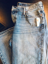 Sensormatic SuperTag III Gray - 58KHz, attached to denim jeans