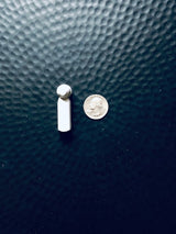 Stylus Tag Gray - Sensormatic Compatible 58KHz, shown next to a quarter for scale