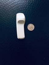 Sensormatic SuperTag I Gray - 58KHz, shown next to a quarter for scale