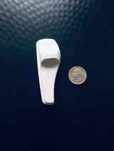 Sensormatic SuperTag II Gray - 58KHz, shown next to a quarter for scale