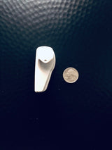 Sensormatic SuperTag III Gray - 58KHz, shown next to a quarter for scale